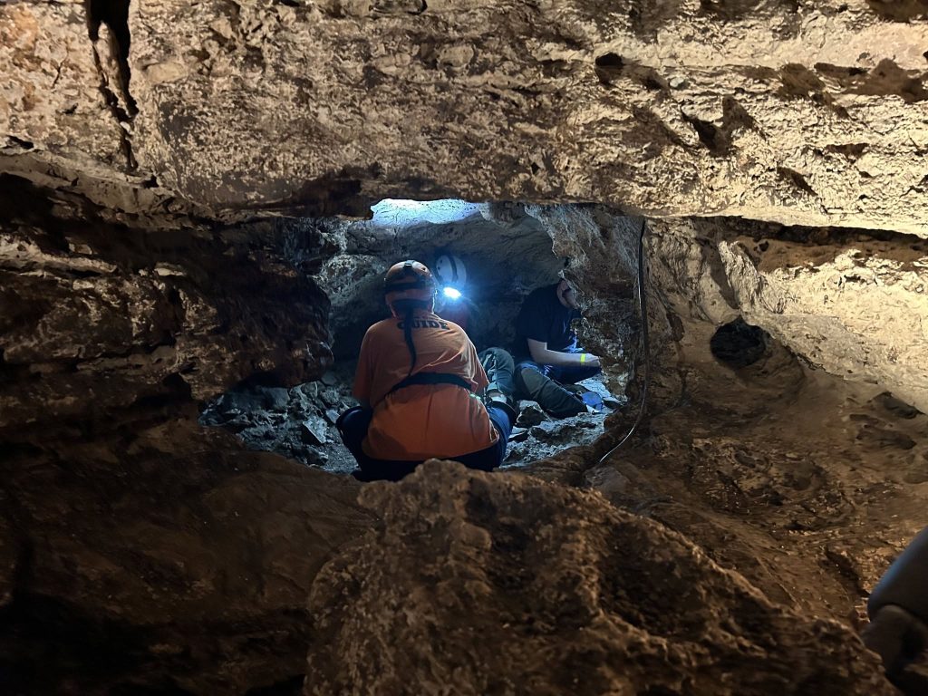 Longhorn Cavern State Park guide leading a wild cave tour