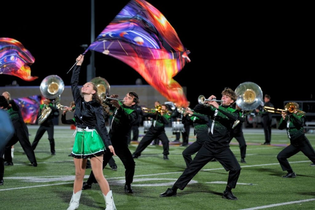 The Burnet Esprit De Corps performs its marching program, “Rewrite the Stars,” during halftime of the Bulldog football game a day prior to the region marching contest.